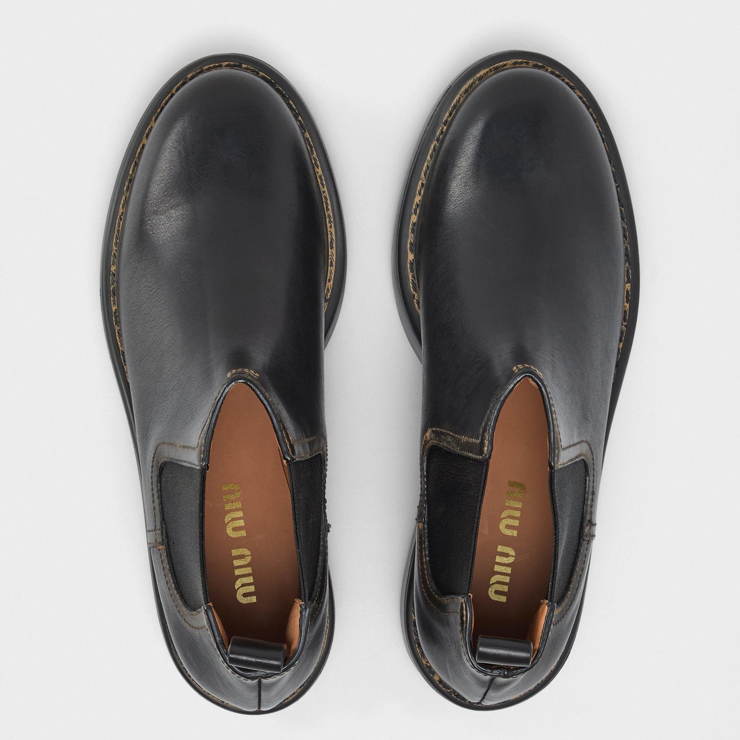 Miu Miu Women's Streamlined Low Heel Flat Ankle Boots